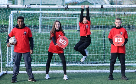 4 teens wearing red